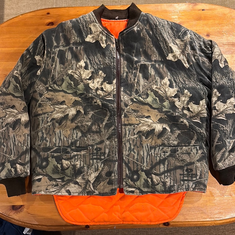 Mossy Oak Camouflage Jacket with Vibrant Orange Accent